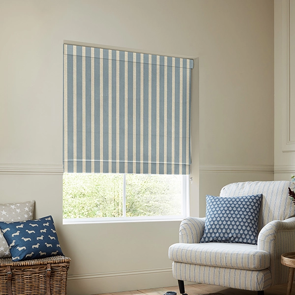 Room with blue stripe design roman blind from Emily Bond