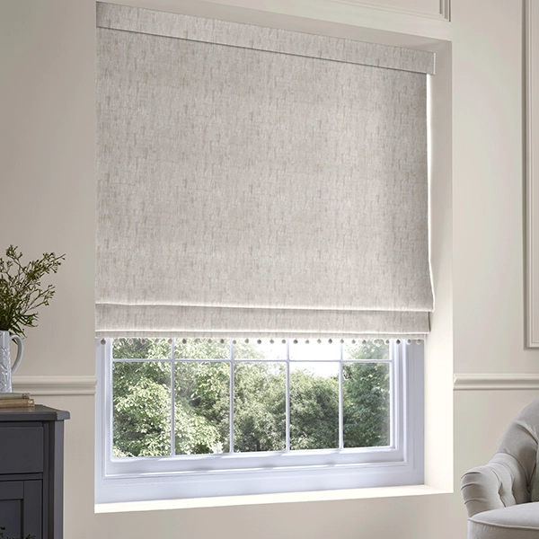 Living room with pom-pom trim roman blinds from Laura Ashley
