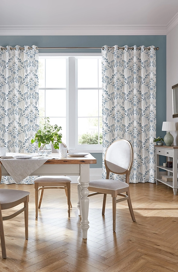 Room with white and blue curtains from Laura Ashley Collection