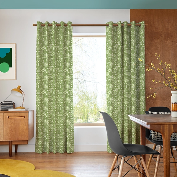 Room with geometric flower design curtains from Orla Kiely