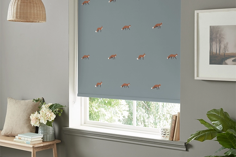 Room with green lemur design curtains from Sara Miller