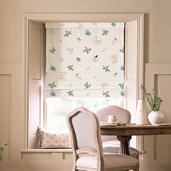 Room with white floral roman blind from Sophie Allport