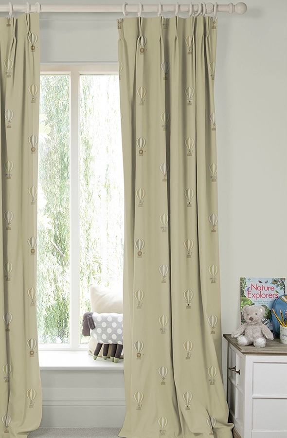 Room with gold curtains in balloons from Sophie Allport