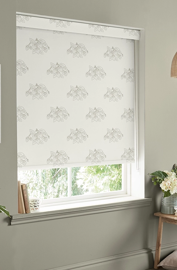 Room with white roller blind in strawberry from Sophie Allport