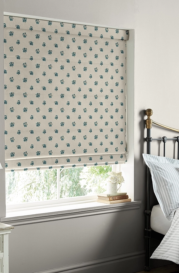 Room with geometric flower design roman blind from Sophie Allport