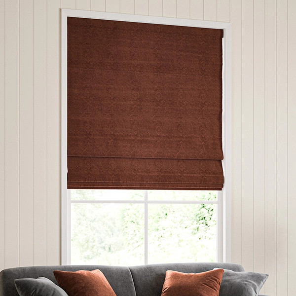 Room with red embroidered floral roman blind from William Morris at Home