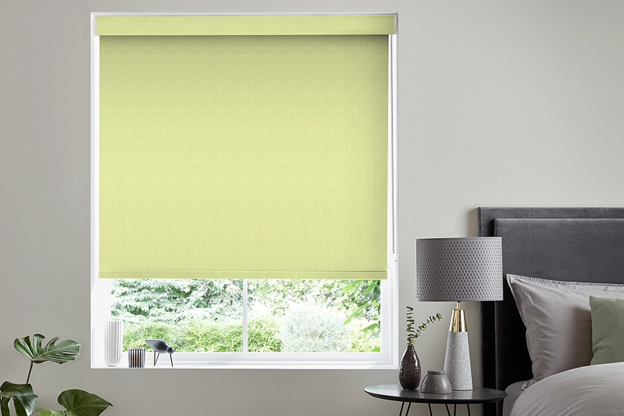 Bedroom with a yellow blackout roller blind from Edit Rollers collection