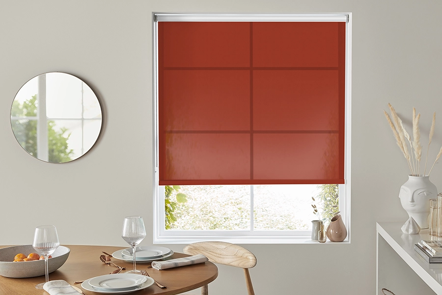 Dining room with red sheer roller blind from Edit rollers collection