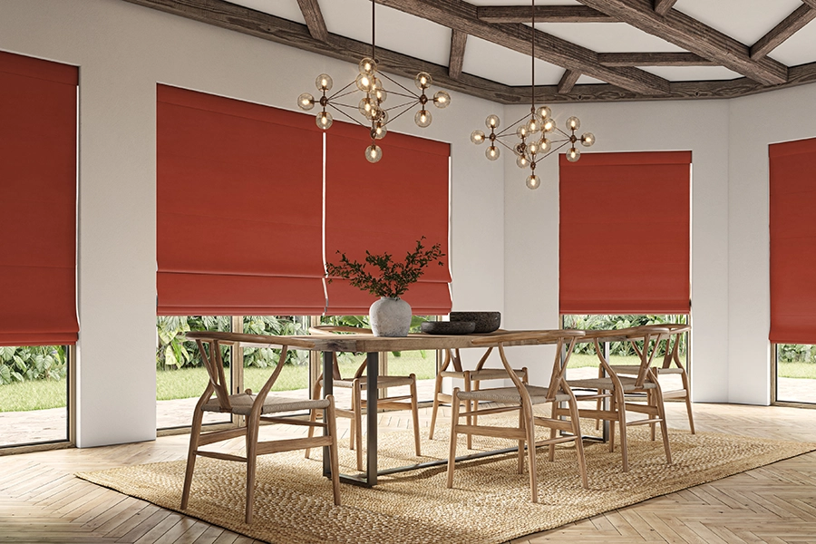 Red roman blinds form Edit Softs Vol.2 collection in a dining room