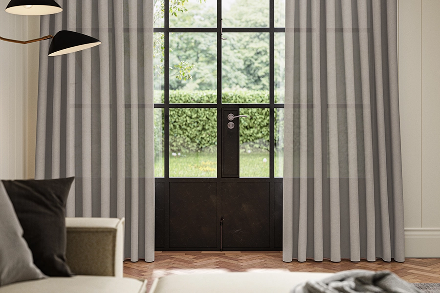 Sheer grey curtains from illumin8's Loom collection