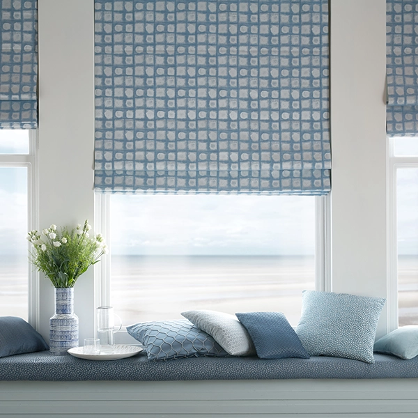 Room with blue geometric roman blinds from illumin8